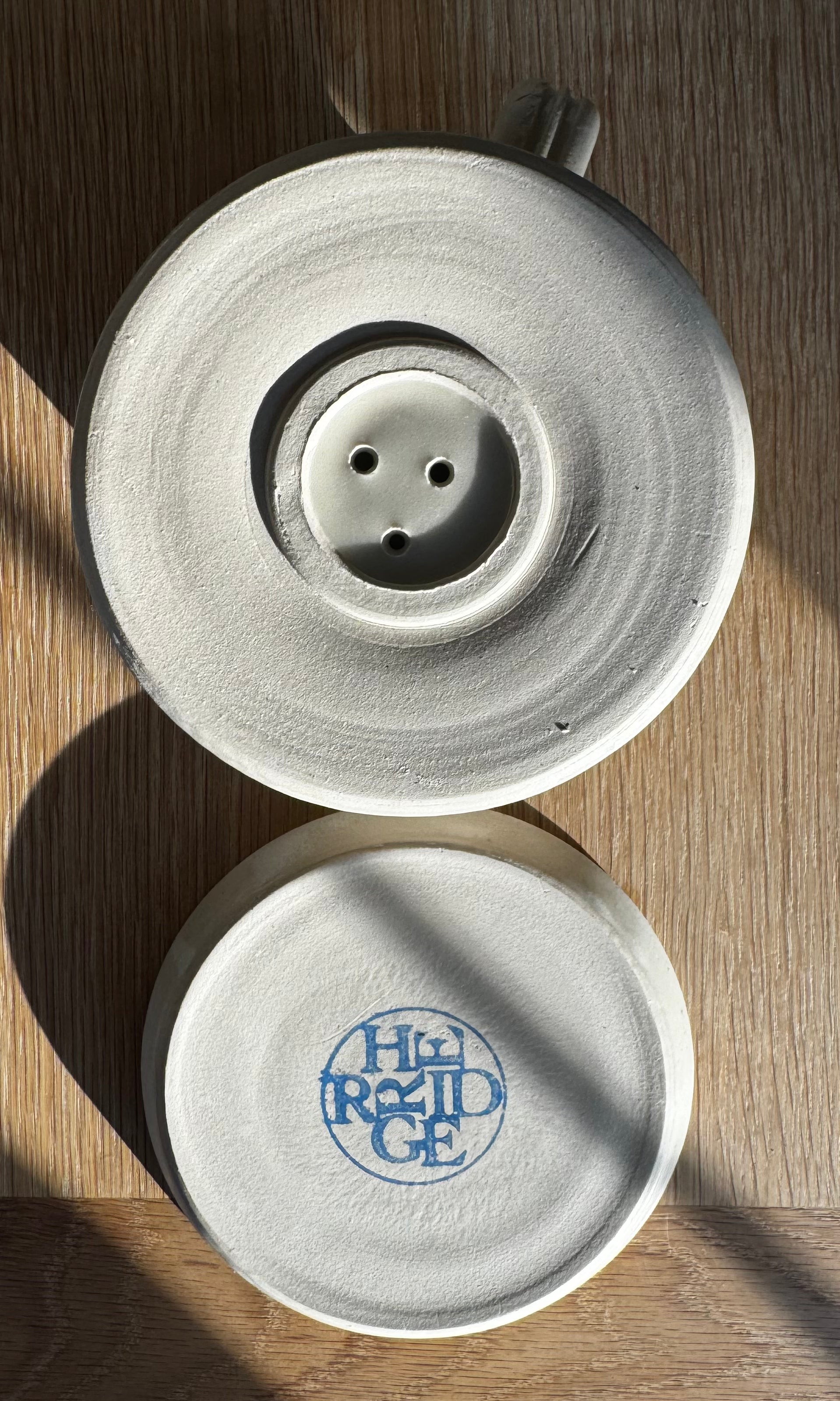 Base of handmade ceramic oatmeal coloured coffee pour-over from above made by Herridge Pottery.