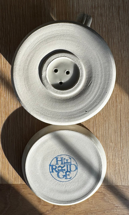 Base of handmade ceramic oatmeal coloured coffee pour-over from above made by Herridge Pottery.