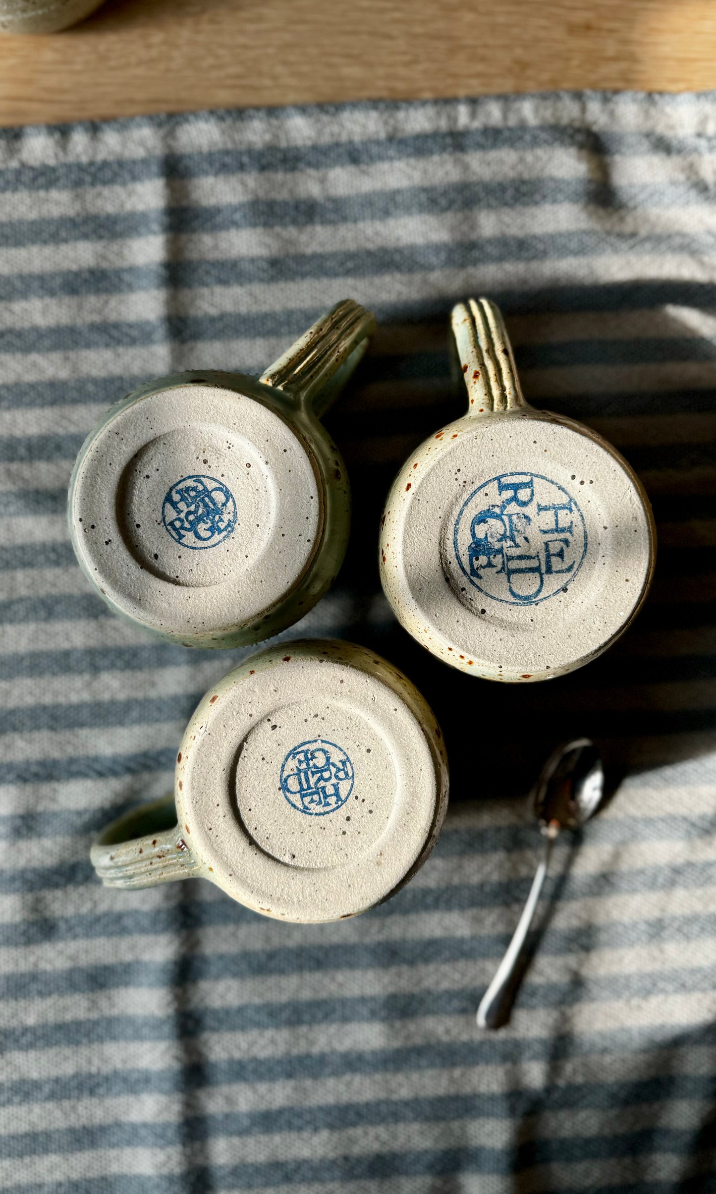 Handmade ceramic celadon green mugs from Herridge pottery - bottom