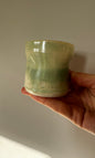 Handmade ceramic dimple coffee cup by Herridge Pottery in Celadon Green.