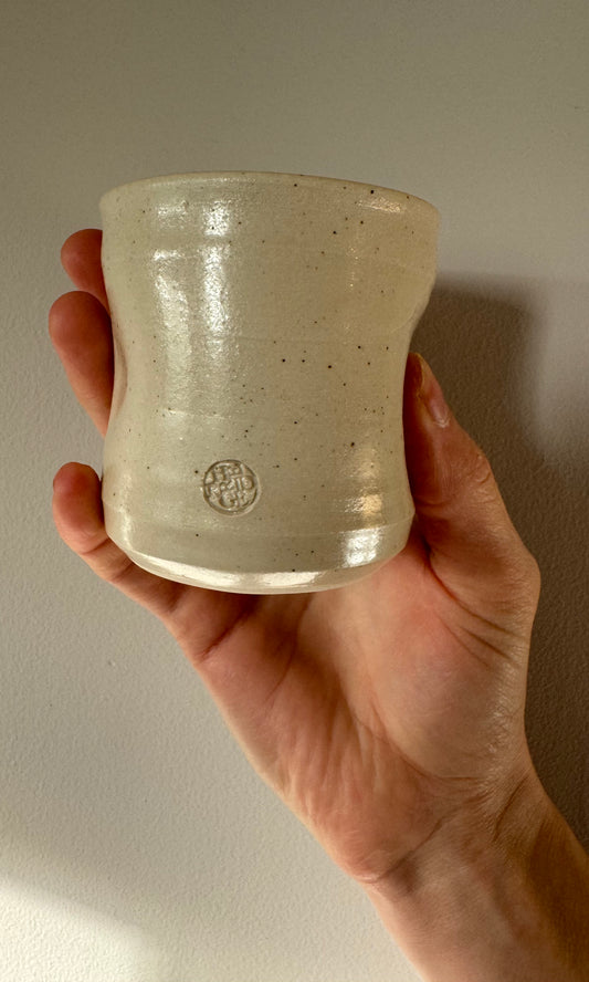 Handmade ceramic dimple coffee cup by Herridge Pottery in Oatmeal