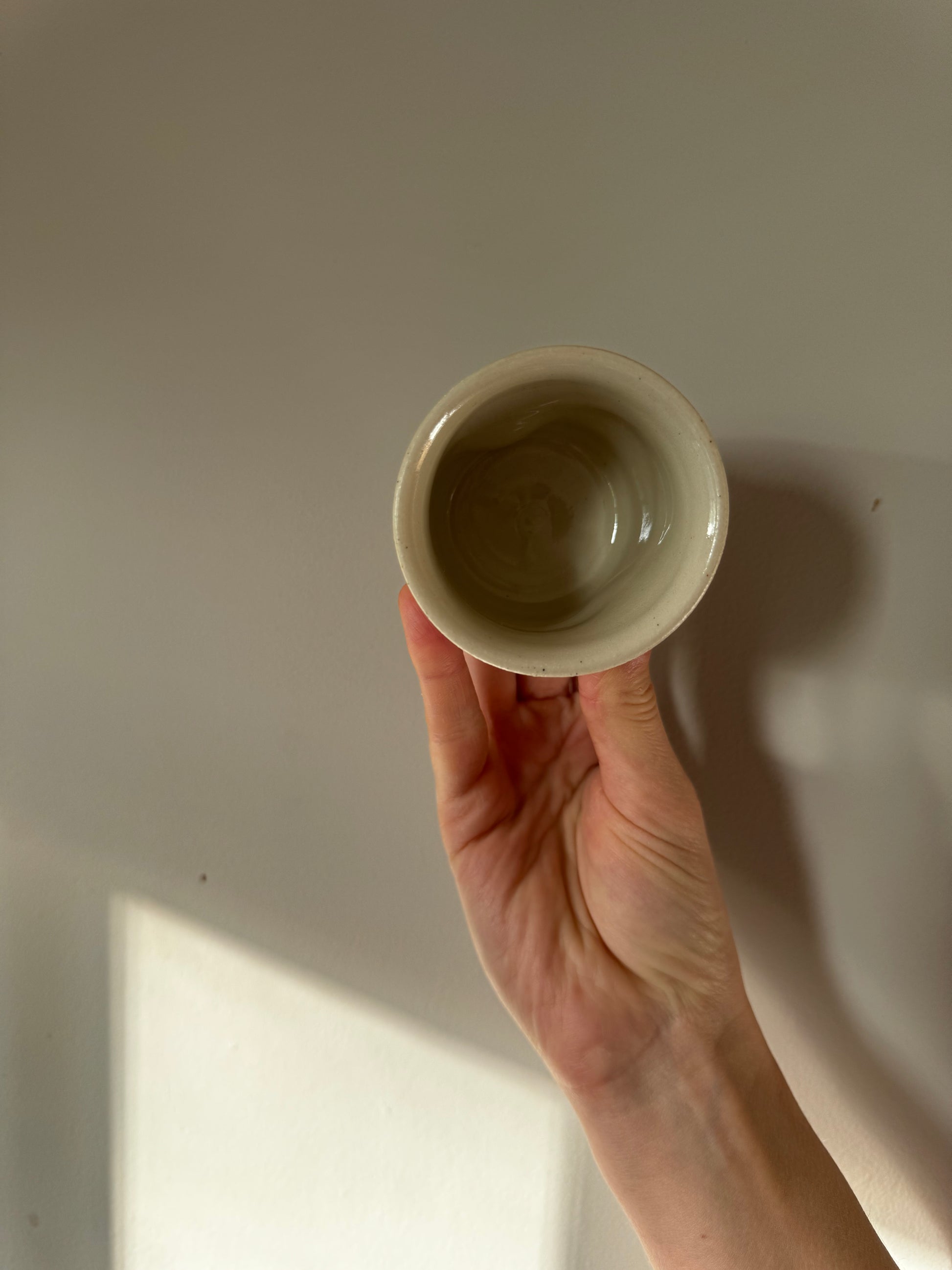 Handmade ceramic dimple coffee cup by Herridge Pottery in Oatmeal