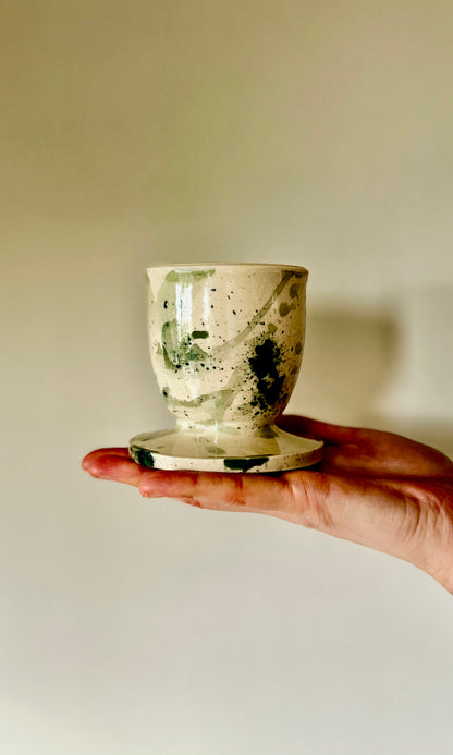 Handmade ceramic mallard splatter butter bell from Herridge pottery - bell held