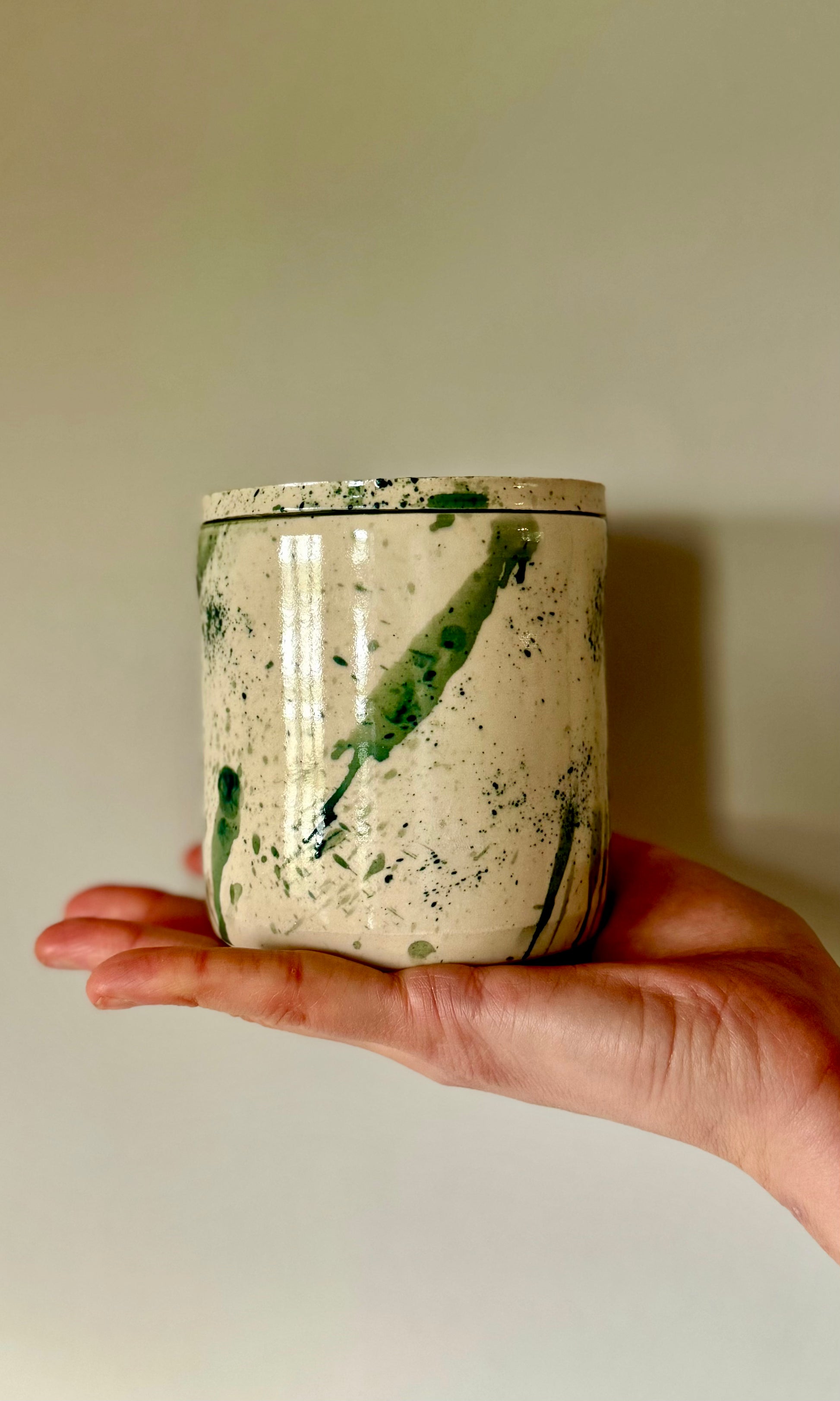 Handmade ceramic mallard splatter butter bell from Herridge pottery - held