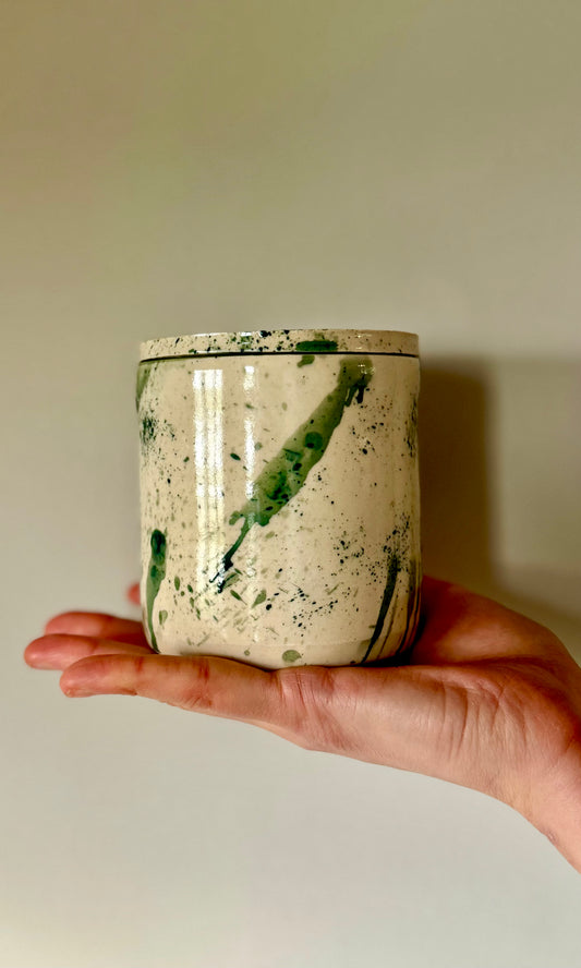 Handmade ceramic mallard splatter butter bell from Herridge pottery - held