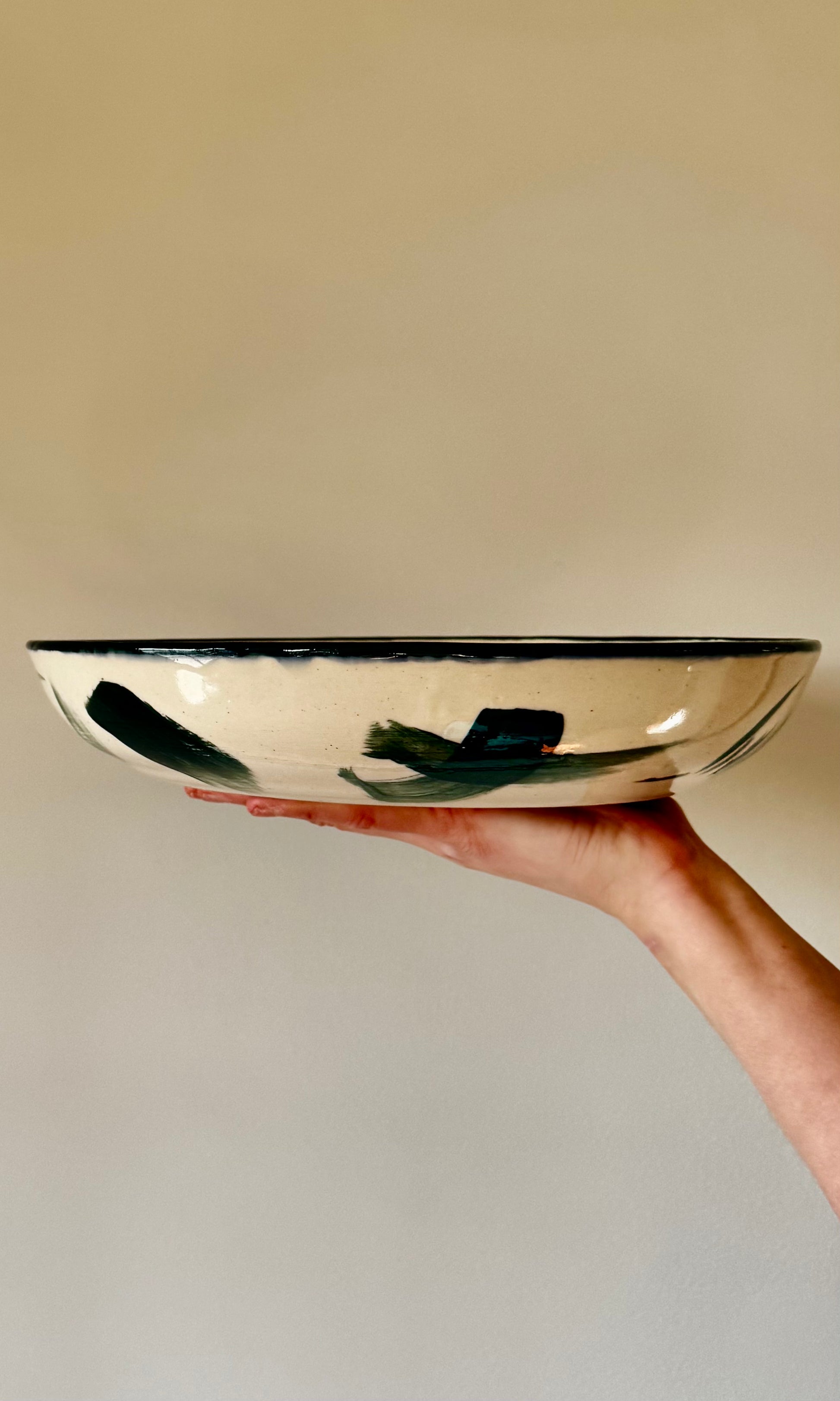 Handmade ceramic mallard swoosh extra large feasting bowl from Herridge Pottery - held side