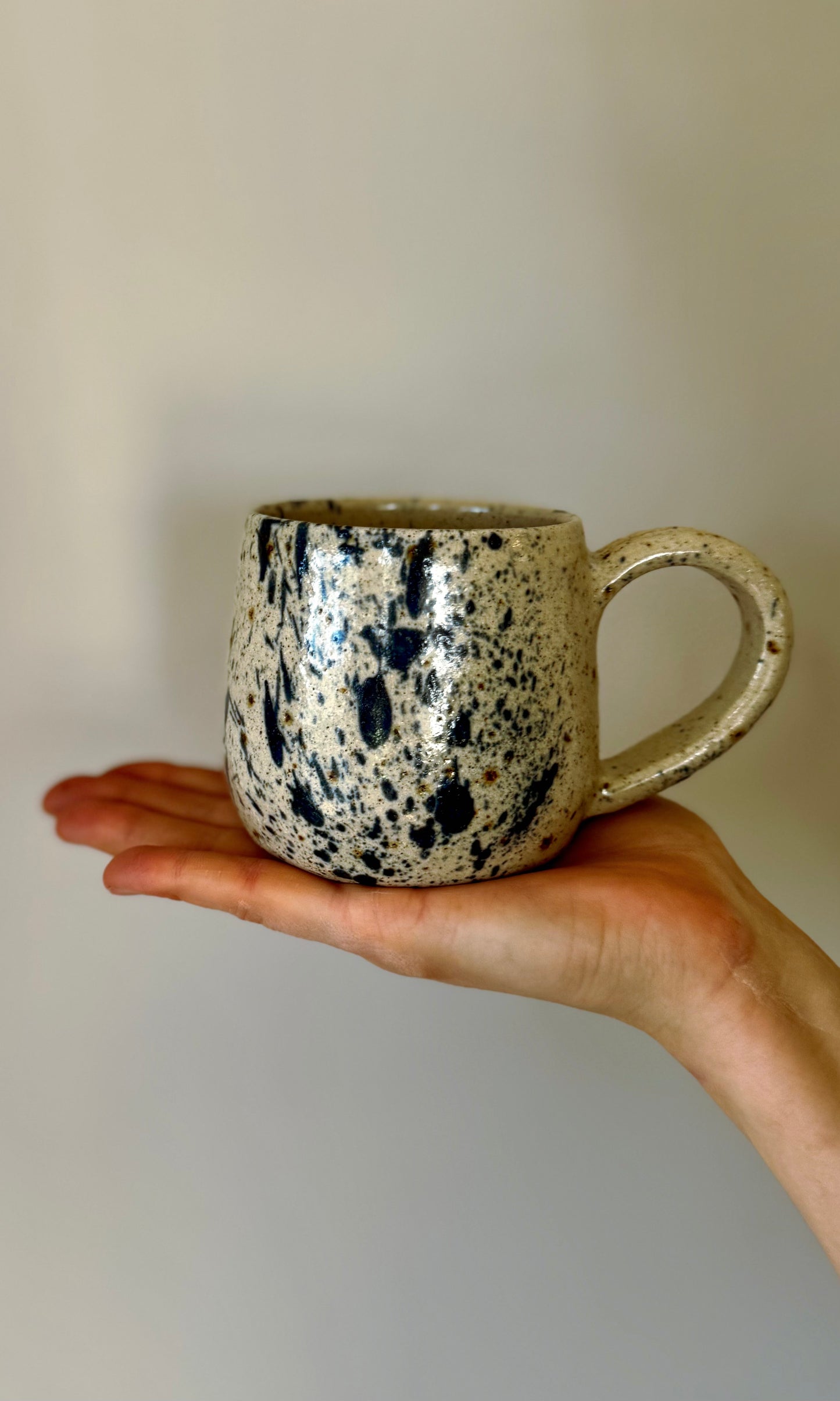 Handmade ceramic mug in blue splatter from Herridge Pottery