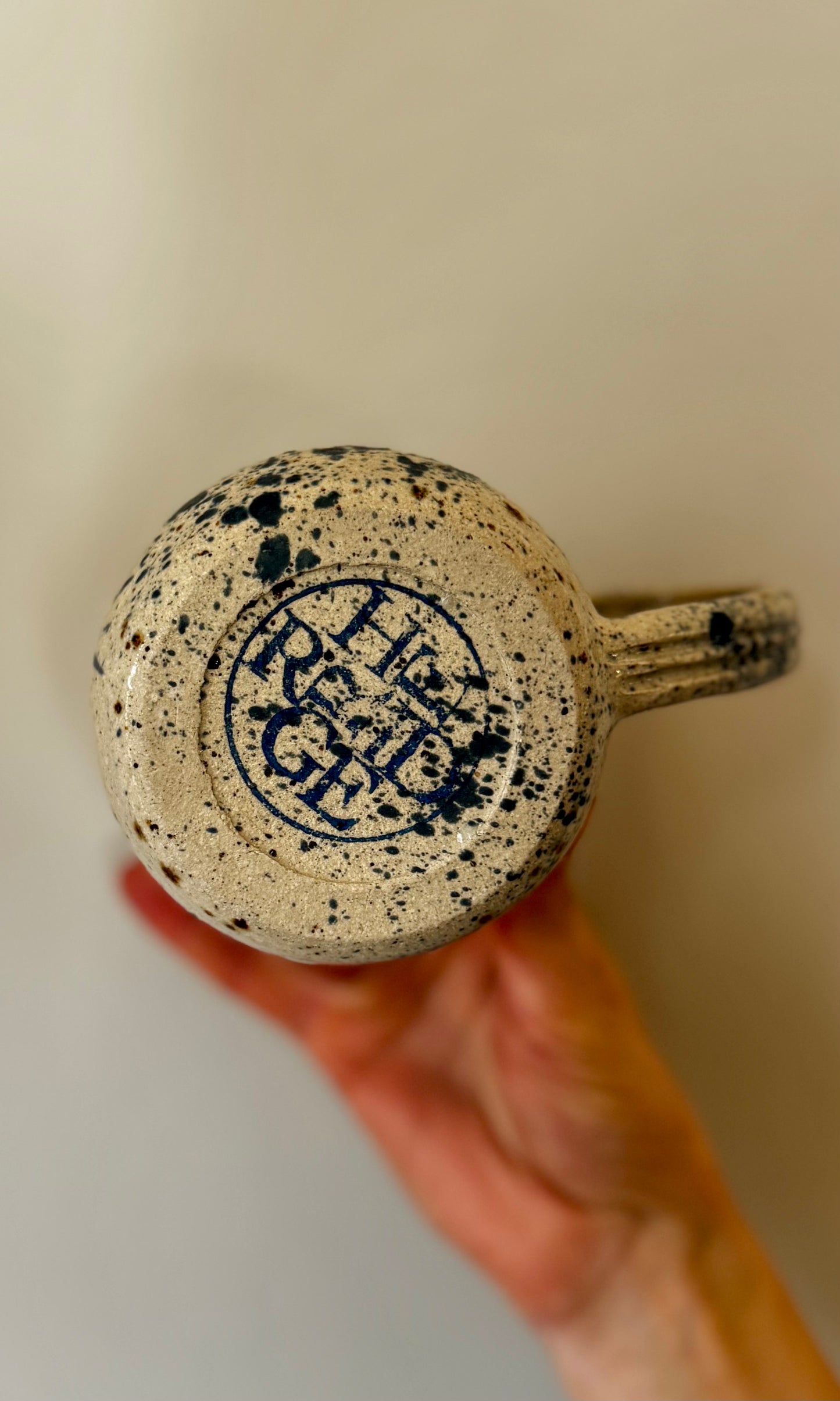 Handmade ceramic mug in blue splatter from Herridge Pottery - bottom