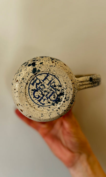Handmade ceramic mug in blue splatter from Herridge Pottery - bottom