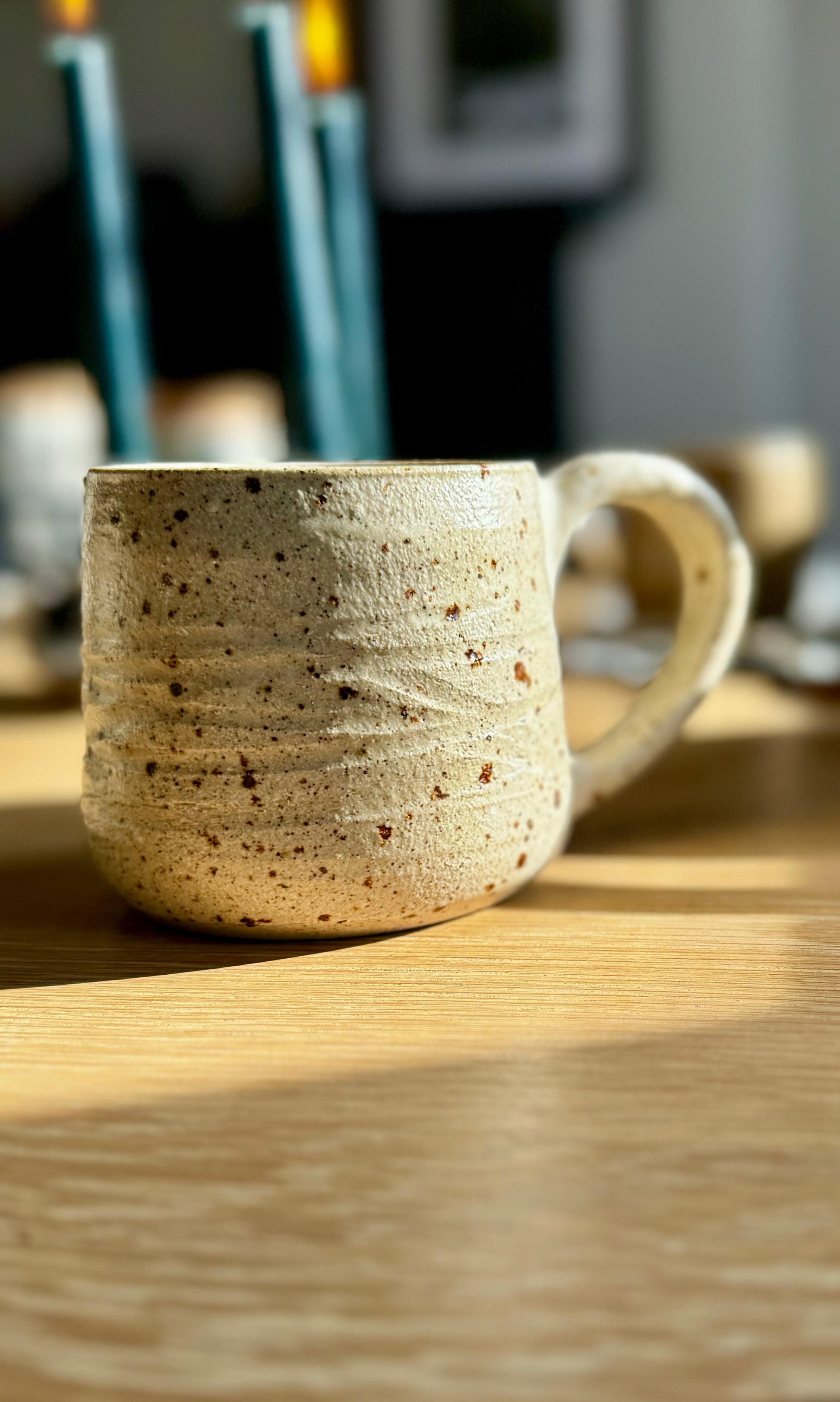 Handmade ceramic oatmeal mug from herridge pottery - on table
