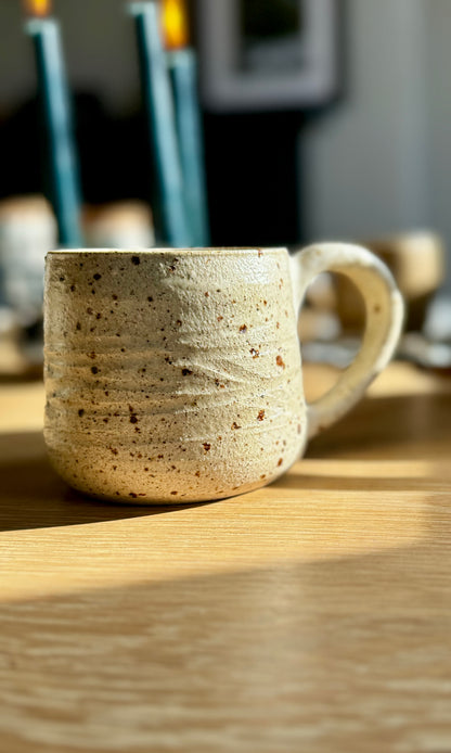 Handmade ceramic oatmeal mug from herridge pottery - on table