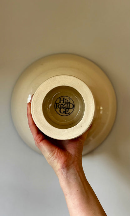 Handmade ceramic pedestal feasting bowl from Herridge Pottery - held bottom