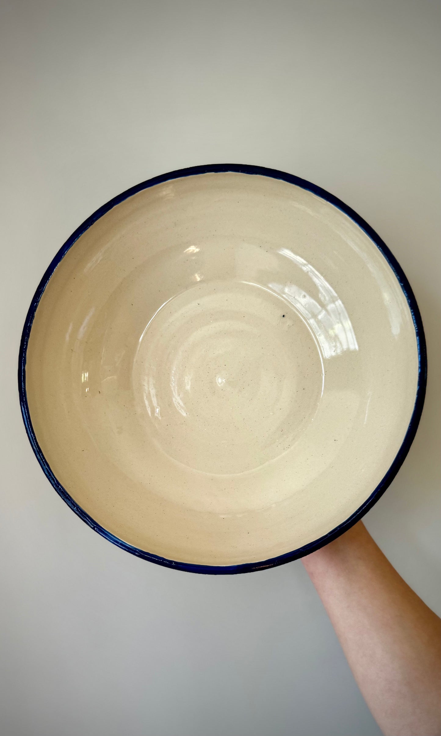Handmade ceramic pedestal feasting bowl from Herridge Pottery - held top