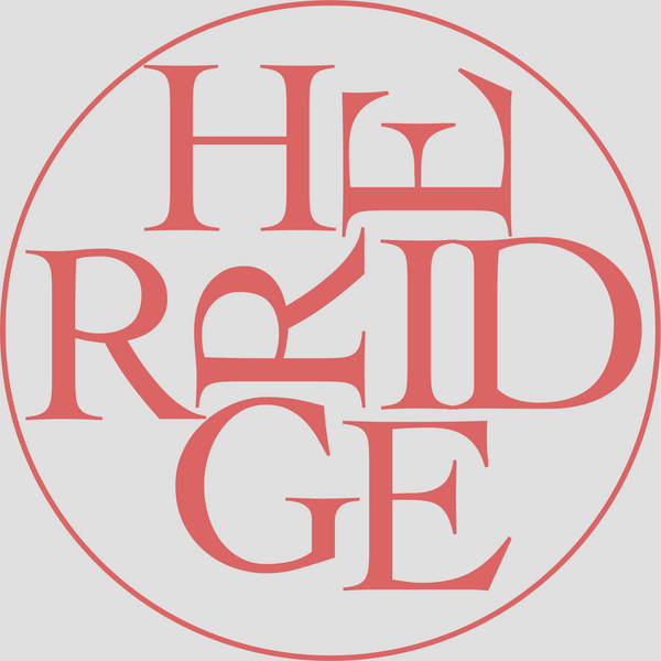 Herridge Pottery Logo in circular form.. Text in red on grey background